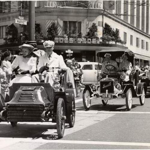 [Antique cars lead the parade down Market St. of sports carts scheduled to compete in upcoming Guardsmen's sports car road races at Golden Gate Park]