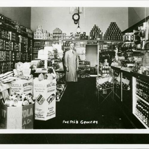[Sebastian standing in Fuetsch Grocery store in 1936]