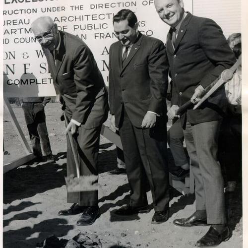 [Mayor Shelley, George Vetari and M. Walter G. Jebe standing on the proposed site of the Excelsior Library