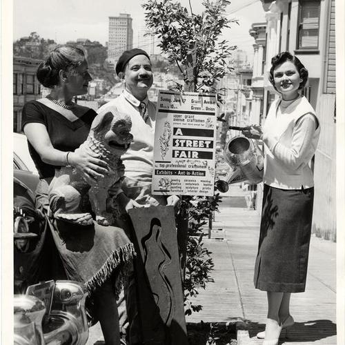 [Mary Erckenbrack, Peter Macchiarini and Judy Weld standing in front of a Street Fair sign]