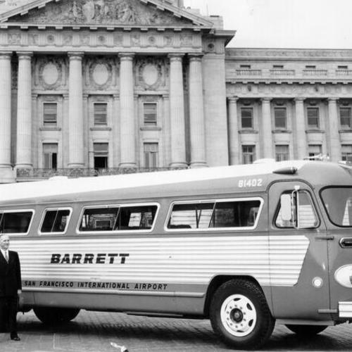 [Hobart Barrett and James H. Turner inspecting an airport bus parked in front of City Hall]