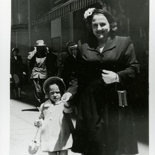 [Carol with her mother downtown on Market Street]