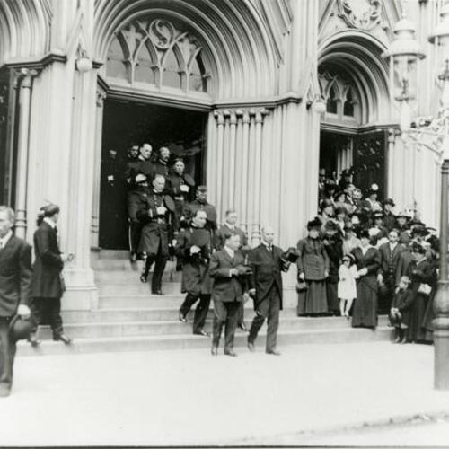 [Funeral of policeman Edward Maloney with Mayor Rolph in front of the procession leaving Saint James Church on Guerrero Street]