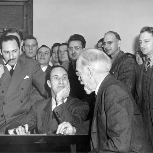 [Harry Bridges and interested spectators and CIO members in courtroom]