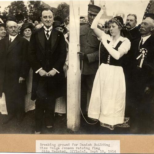 Breaking ground for Danish Building, Miss Helga Jensen raising flag, Otto Wadsted, Official. Sept. 15, 1914