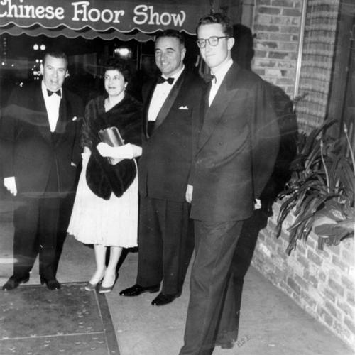 [U. S. State Department Chief of Protocol Wiley T. Buchanan, Mrs. George Christopher, Mayor George Christopher and King Baudouin of the Belgians outside the Forbidden City nightclub]