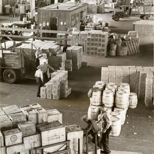 [Workers clearing docks of cargo accumulated during strike]
