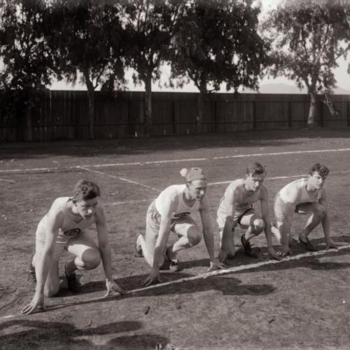 Y. M. C. A. relay racing team posing for portrait on field