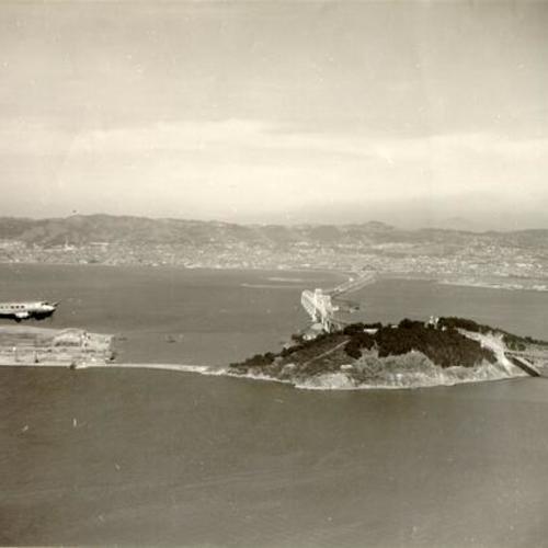 [Aerial view of Treasure Island, Yerba Buena Island and the San Francisco-Oakland Bay Bridge]