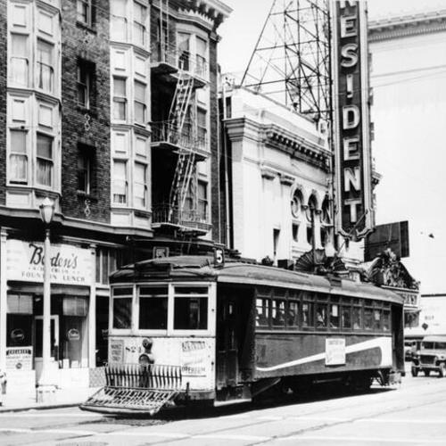 [Streetcar passing in front of the President Theatre]