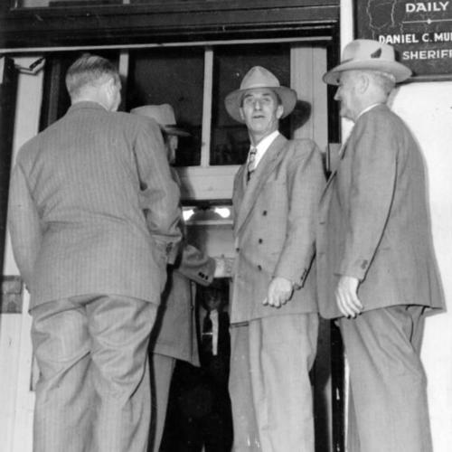 [Harry Bridges shown entering City jail 19 days ago, flanked by U. S. marshals, after Federal Judge George B. Harris ordered his bail revoked. The Circuit Court of Appeals ordered him free today]