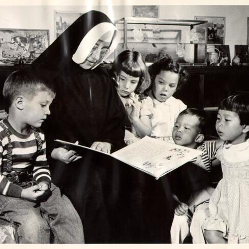 [Story hour at the Holy Family Day Home]