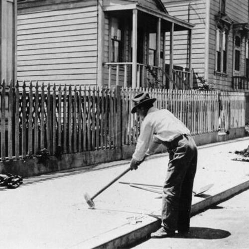 [Man working on construction along Girard street]