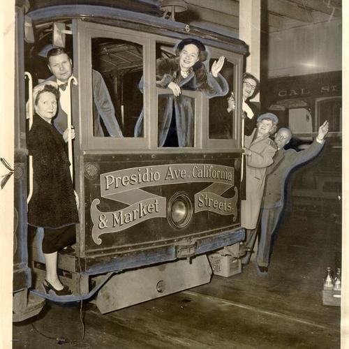 [Group of people celebrating the liquidation of the California Street Cable Car Company and the beginning of the cable car line's operation as a municipal utility]
