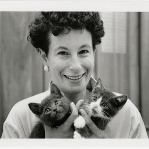 Joyce Brown holding two kittens