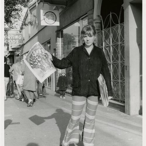 [Haight Ashbury - woman holding up a newspaper]