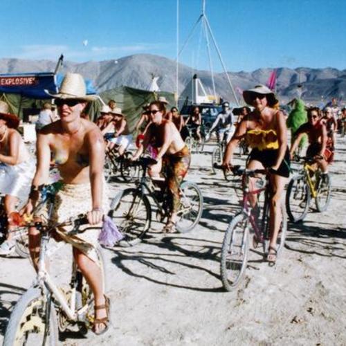 [Critical Tits biking event for women at Burning Man in Nevada]