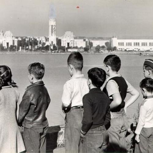 [Teacher Juanita Armstrong leading a class from school for children of military personnel at Yerba Buena Island on a tour of the island]