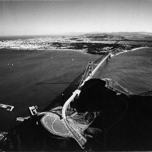 [Aerial view of the Golden Gate Bridge from over Marin County, looking south]