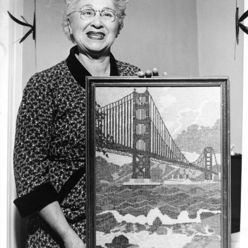 [Florence Thomson displaying the handiwork she will exhibit at the Senior Citizen Hobby Show at the Emporium Auditorium]