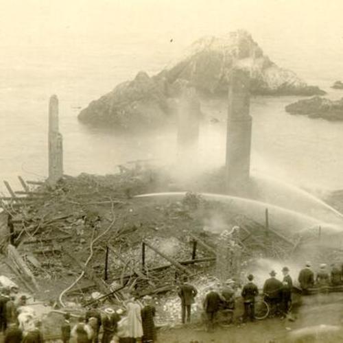 [Cliff House burning as spectators watch]