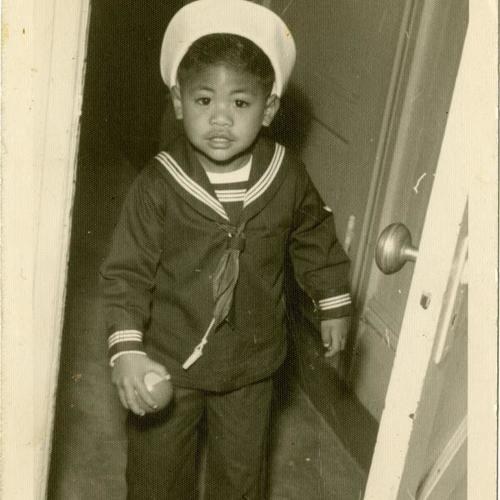 [Richard as a boy at his house in his sailor suit with Uncle Ray Galvan, a professional photographer, taking pictures]