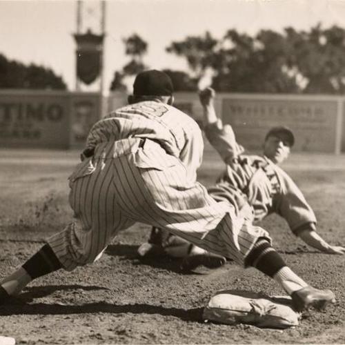 [Dario Lodigiani of the Oakland Oaks sliding into 3rd base during a game with the San Francisco Seals]