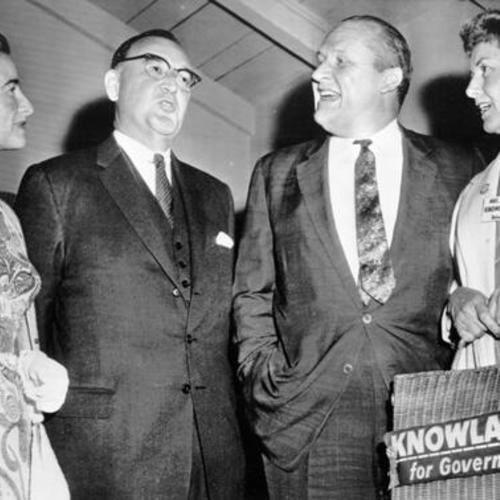 [Attorney General Edmund G. (Pat) Brown and his wife (left) meet Senator William Knowland and Mrs. Knowland (right)]