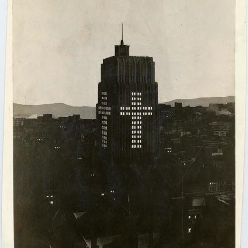 [View of the Pacific Telephone & Telegraph Company building lit up for Easter]