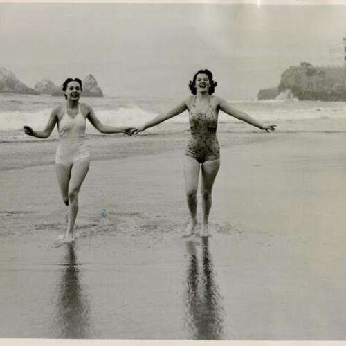 [Lila Horning and Evelyn Schwartz frolicking on the beach]