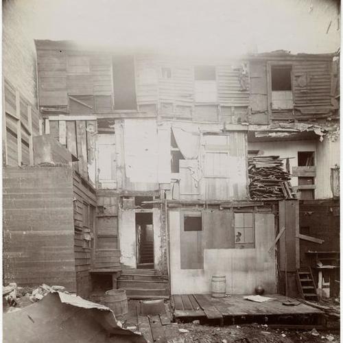 083 Demolition of wooden buildings in progress
