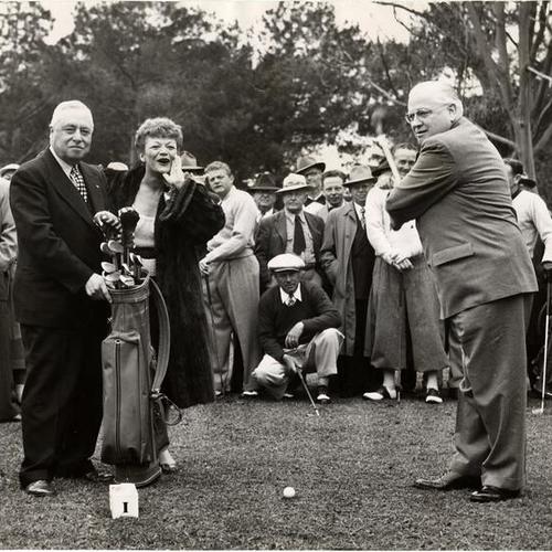 [President of the Recreation-Park Commission Louis Sutter, singer Beatrice Kay and mayor Elmer E. Robinson at opening of new golf course in Golden Gate Park]