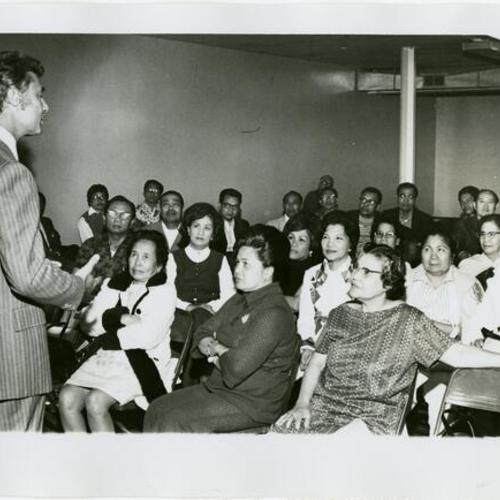 [George Moscone speaking at Filipino event]