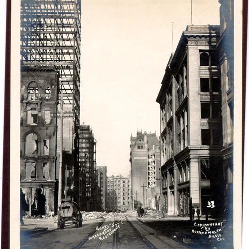 [View of Geary Street, east of Stockton, after the earthquake and fire of 1906, looking toward Market Street with the Palace Hotel in distance]