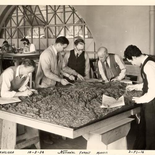 [SERA workers constructing a national forest model]