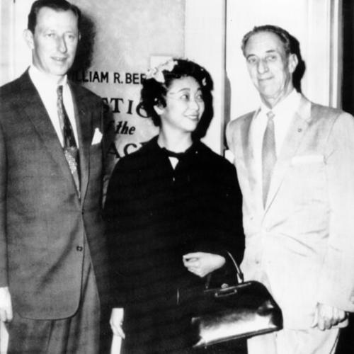 [Harry Bridges and bride Noriko Sawada smile as they leave office of justice of the peace, with attorney Sam Francovich (left)]