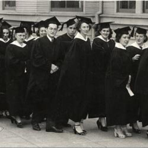 [Students dressed for graduation ceremony at San Francisco State College]