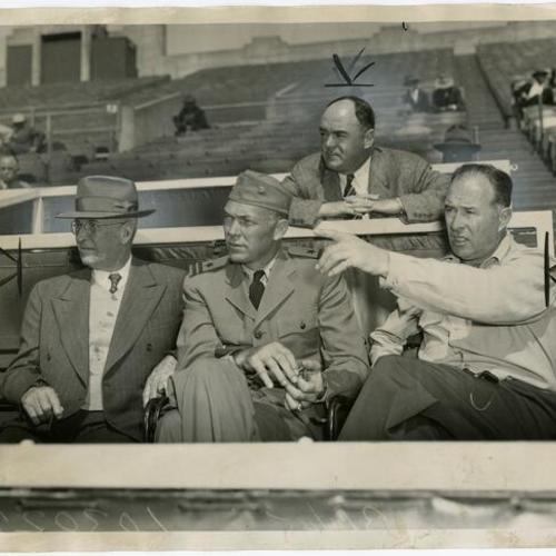 [Charles Graham, Bill Dickey, Lefty O'Doul, Willie Kamm in rear at Seals Stadium]