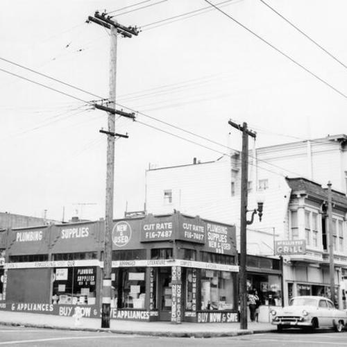 [Unidentified corner of McAllister Street in the Western Addition area of San Francisco]
