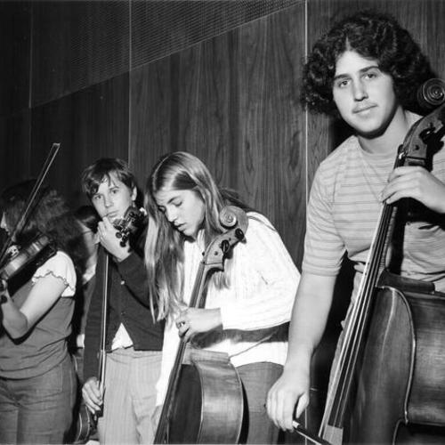 [Students studying music at Lowell High School]