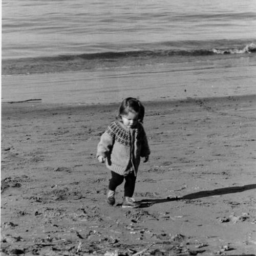 [Young child walking on Ocean Beach]