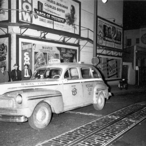 [Veterans Cab Company taxicab at Golden Gate and Jones streets]