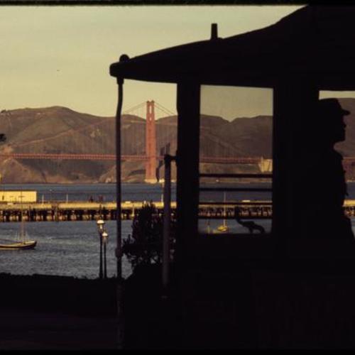 View of cable car and Golden Gate Bridge during sunrise