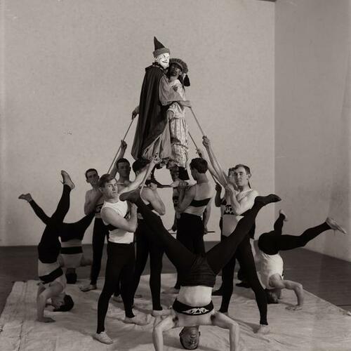 Portrait of Y. M. C. A. gymnastics team rehearsing