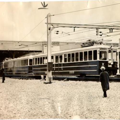 [First electric train to cross the Bay Bridge arriving in San Francisco from Oakland]