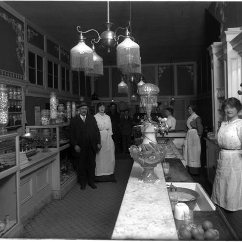Moody's Candy Store interior with owner and employees