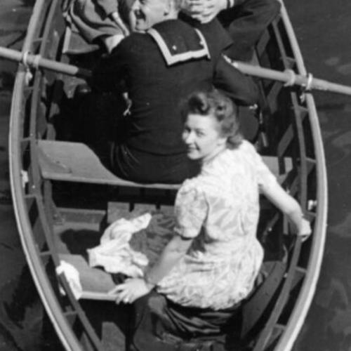 [Two couples in a rowboat on Stow Lake in Golden Gate Park]