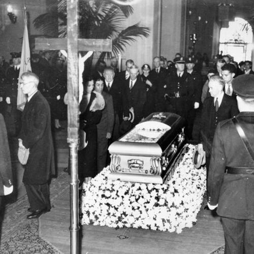 [Mourners pass the coffin of Annie Laurie]