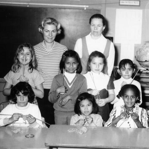 [Teachers Lucille Vasey and Marlene Revollo with knitting class students at McKinley School]