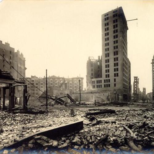 [View of ruins of the Call, Examiner, Chronicle, Palace Hotel and Crocker buildings from Kearny Street]